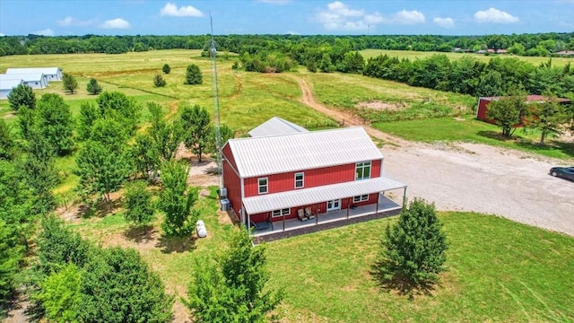 birds eye view of property with a rural view