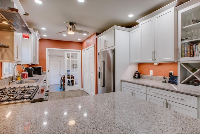 kitchen featuring white cabinetry, stainless steel appliances, sink, and island range hood