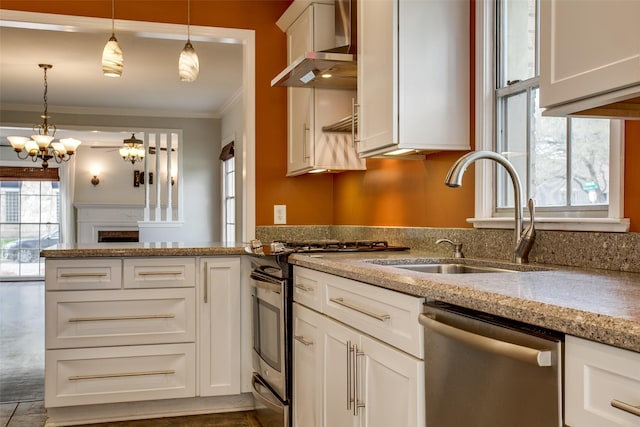 kitchen featuring white cabinetry, sink, wall chimney range hood, and stainless steel appliances