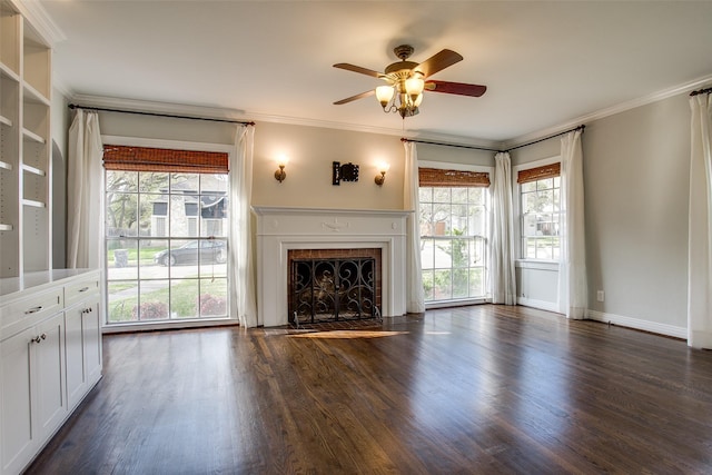 unfurnished living room featuring crown molding, dark wood-type flooring, and ceiling fan