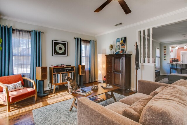 unfurnished living room with ornamental molding, dark hardwood / wood-style floors, a tiled fireplace, and built in features