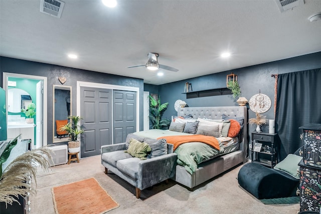 bedroom featuring carpet flooring, ceiling fan, and a closet