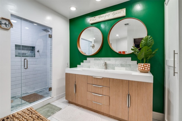 bathroom with vanity, an enclosed shower, and backsplash