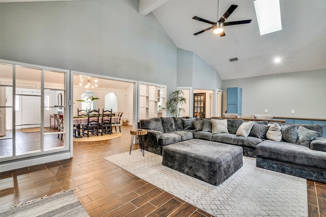 living room featuring beam ceiling, ceiling fan, dark hardwood / wood-style flooring, and high vaulted ceiling