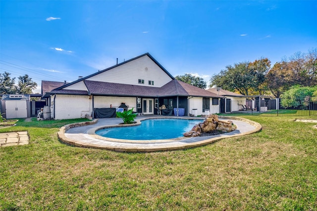 view of swimming pool with a yard and a patio