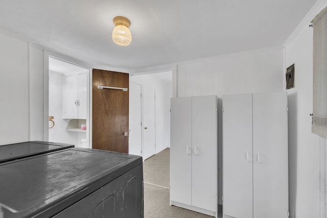 kitchen with white cabinetry and black electric range