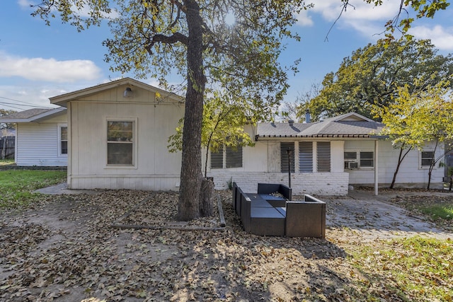 back of house featuring cooling unit