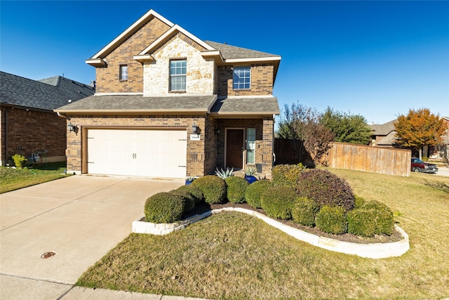 view of front of property with a garage and a front lawn