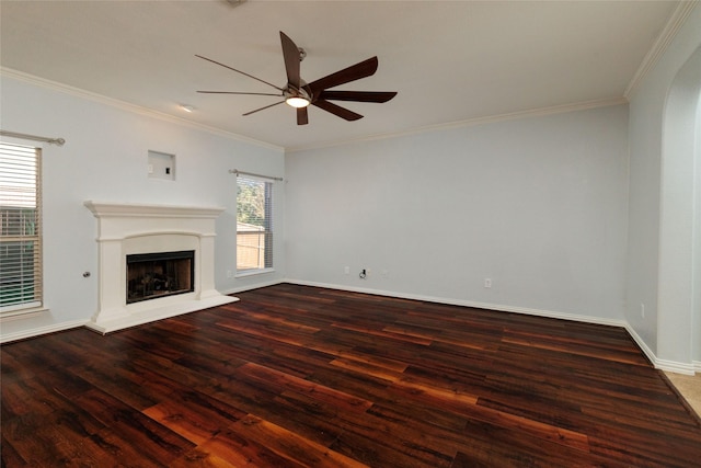 unfurnished living room featuring ornamental molding, ceiling fan, and dark wood-type flooring