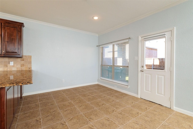 interior space featuring light tile patterned floors and ornamental molding