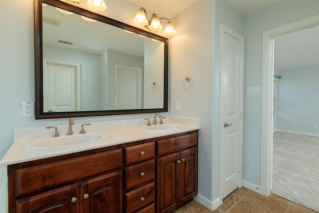 bathroom with tile patterned floors and vanity