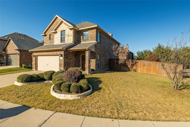 view of front of house featuring a garage and a front yard