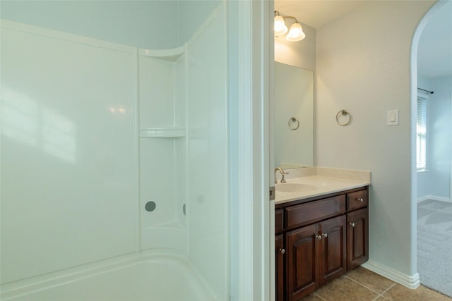 bathroom featuring tile patterned flooring and vanity