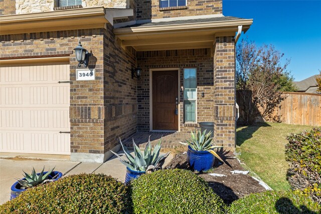 view of exterior entry featuring a garage