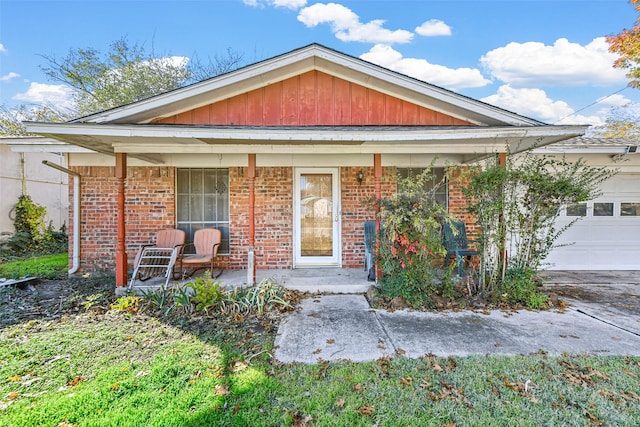 bungalow-style house featuring a porch and a garage