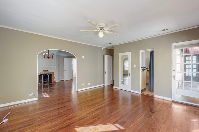 unfurnished room with ornamental molding, ceiling fan, and dark wood-type flooring