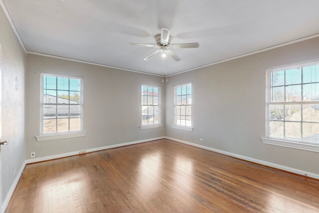 unfurnished room with hardwood / wood-style flooring, ceiling fan, and crown molding