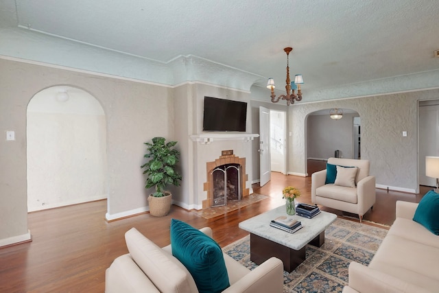 living room featuring hardwood / wood-style flooring and a chandelier