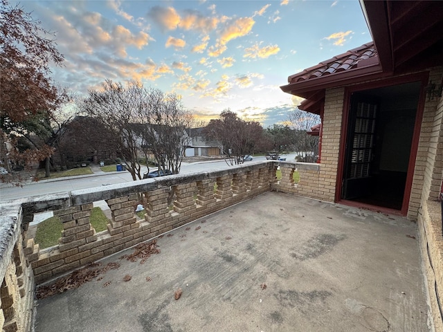 view of patio terrace at dusk