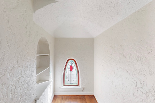 room details featuring hardwood / wood-style floors and a textured ceiling