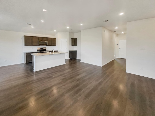 unfurnished living room with sink and dark hardwood / wood-style flooring