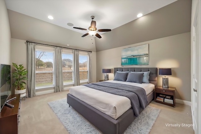 carpeted bedroom featuring ceiling fan and lofted ceiling