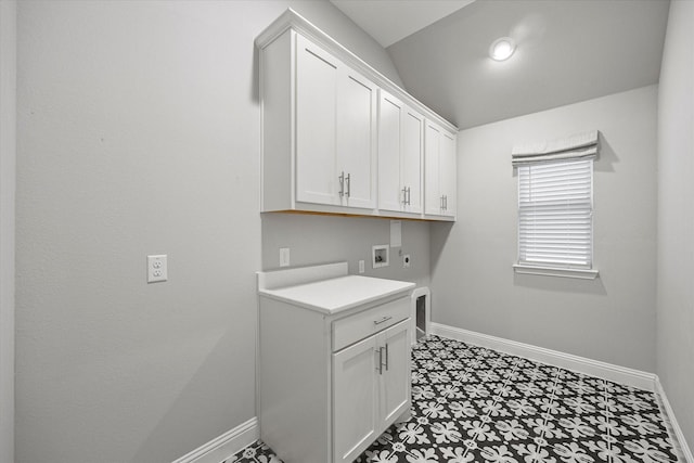 laundry room with electric dryer hookup, cabinets, and hookup for a washing machine