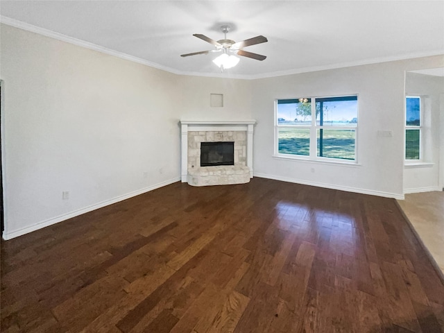 unfurnished living room featuring ceiling fan, dark wood-type flooring, and ornamental molding