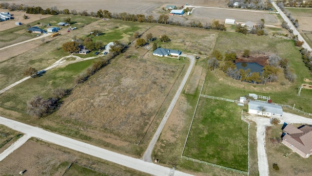 bird's eye view with a rural view and a water view