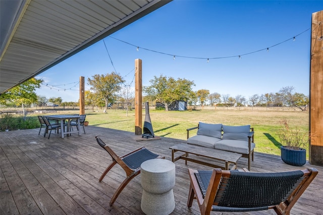 deck with outdoor lounge area and a yard