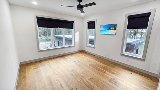 empty room featuring ceiling fan and light wood-type flooring