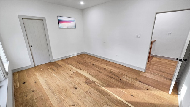 unfurnished room featuring hardwood / wood-style floors