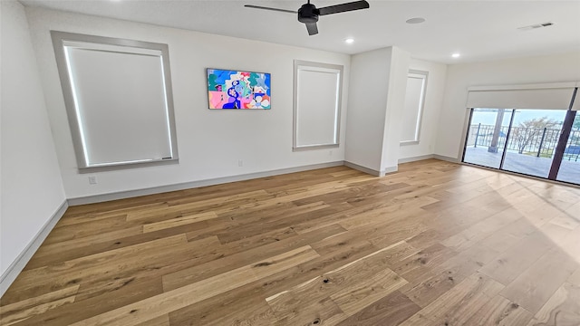 spare room featuring ceiling fan and light wood-type flooring