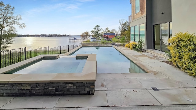 view of swimming pool with a water view