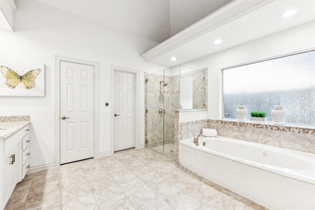 bathroom with vanity and independent shower and bath