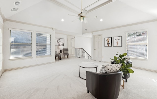 carpeted living room with vaulted ceiling, ceiling fan, and crown molding