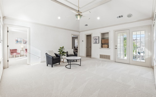 living area featuring lofted ceiling, light colored carpet, ceiling fan, and ornamental molding