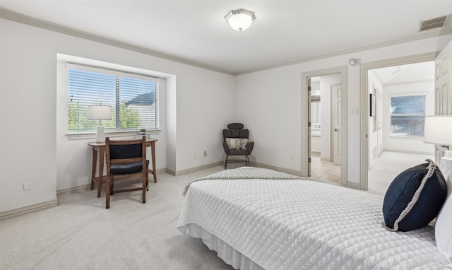 carpeted bedroom featuring crown molding and connected bathroom