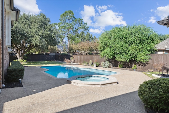 view of pool with an in ground hot tub and a patio