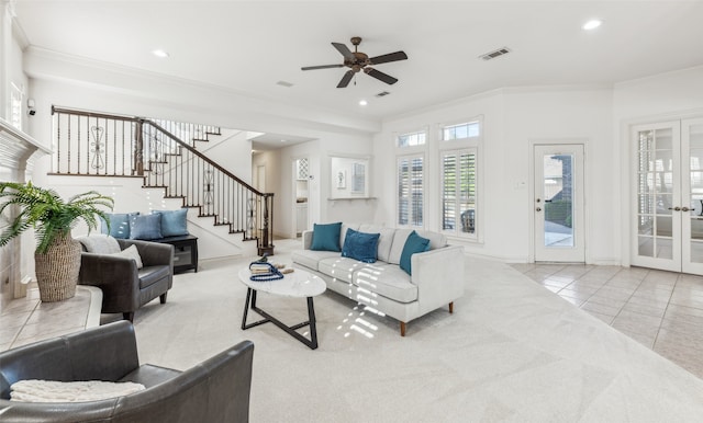 living room featuring crown molding, french doors, ceiling fan, and light tile patterned floors