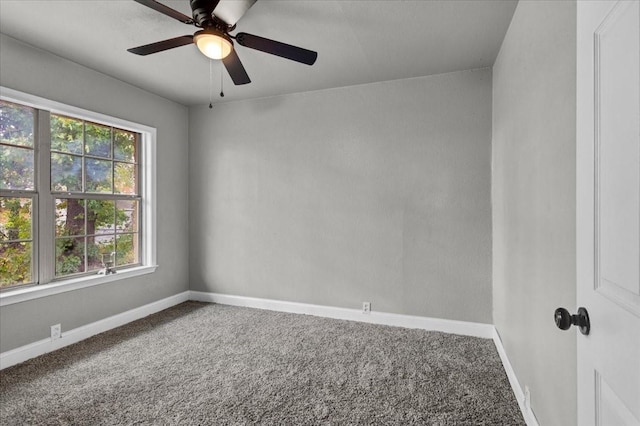 carpeted empty room with ceiling fan