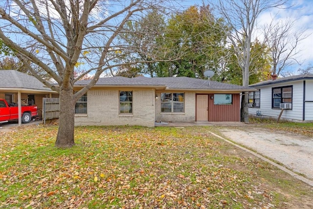 ranch-style house featuring cooling unit