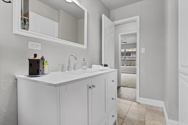 bathroom with tile patterned floors and vanity