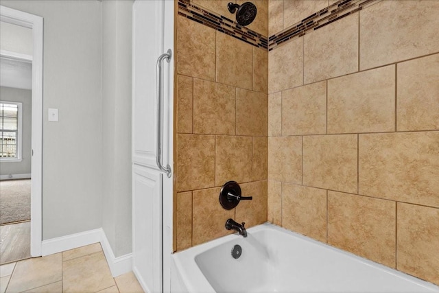 bathroom featuring tile patterned floors and tiled shower / bath combo