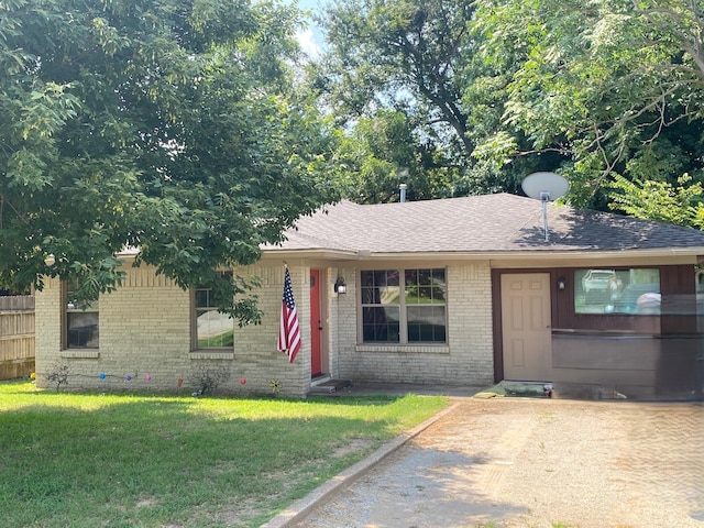 ranch-style home with a front yard