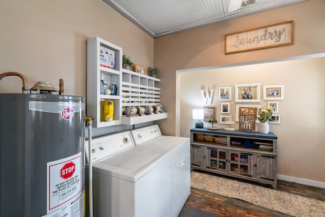 laundry room featuring dark hardwood / wood-style flooring, washing machine and dryer, and gas water heater