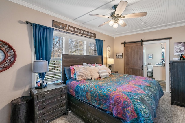 bedroom featuring ceiling fan, a barn door, carpet floors, and crown molding