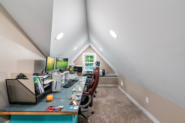 carpeted office featuring vaulted ceiling