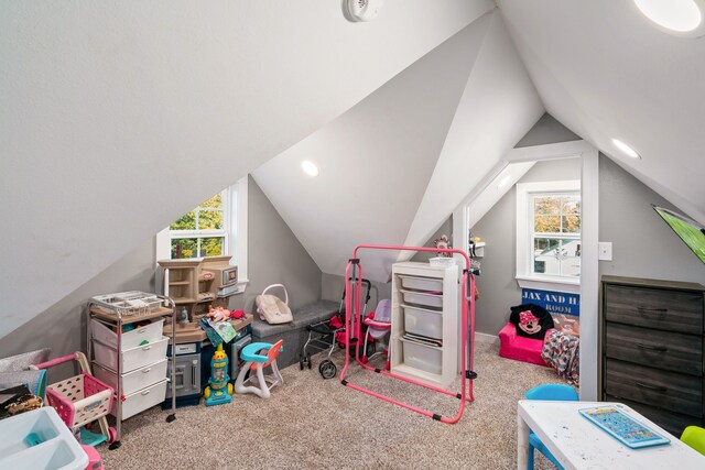 recreation room with plenty of natural light, carpet, and lofted ceiling