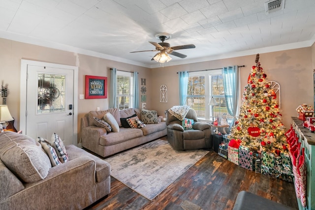 living room featuring ceiling fan, crown molding, and dark hardwood / wood-style floors